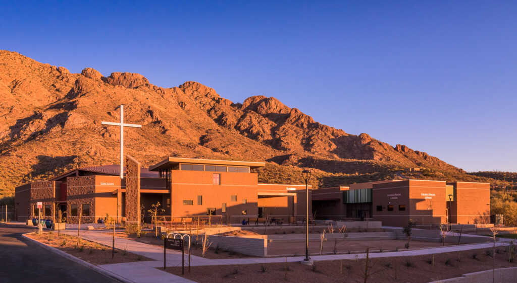 exterior view of buildings during daytime with mountain in background
