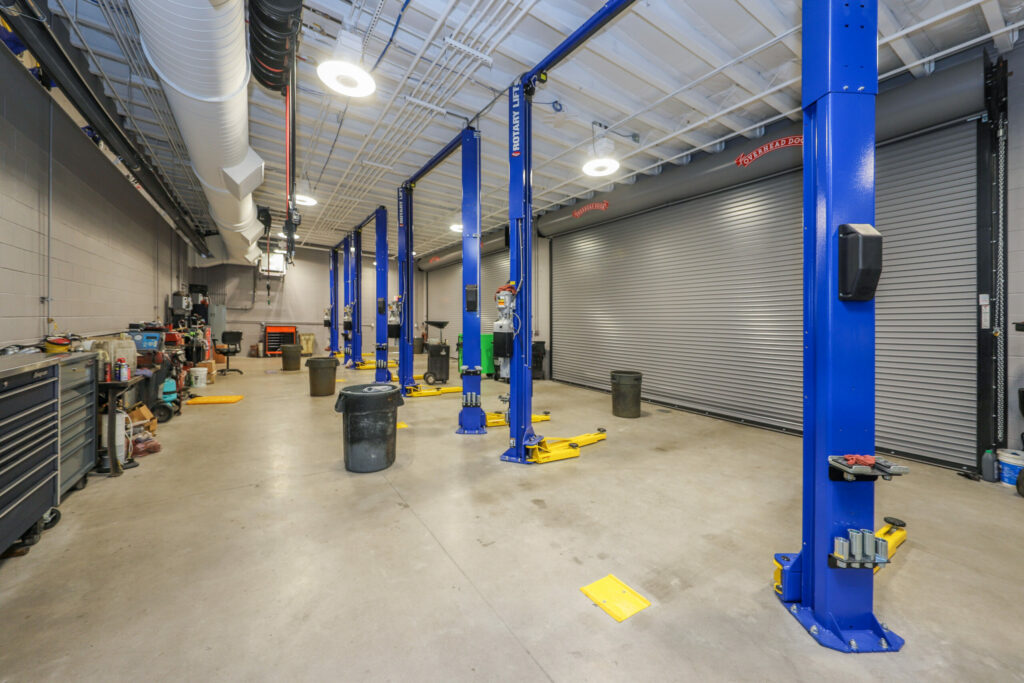 Interior of car service bay with blue metal frames