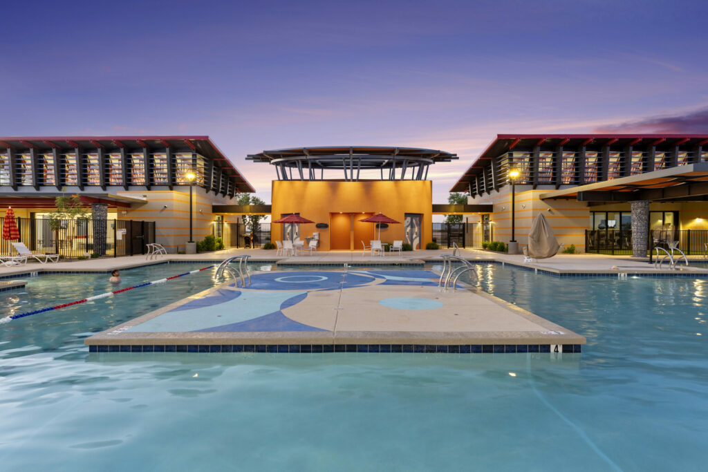 Outdoor pool with clubhouse in the background