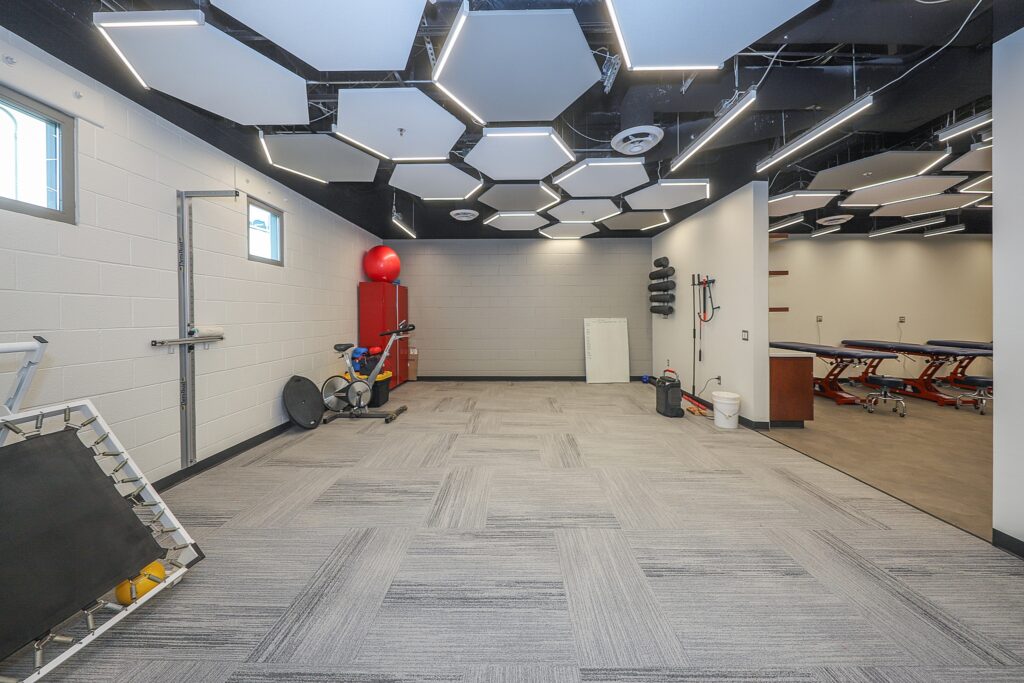 Open room with workout equipment and exercise space