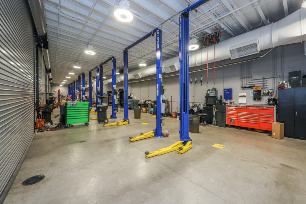 Interior of car service bay with blue frames