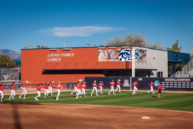 softball team warming up in the outfield