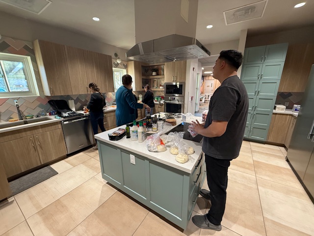 Concord Employee Owners making pizza in a kitchen